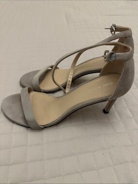 Stuart Weitzman Nunaked suede heels featuring a delicate ankle strap
